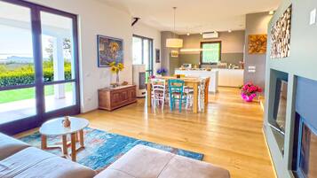 Superior Villa, Lake View | Living area | 50-inch flat-screen TV with digital channels