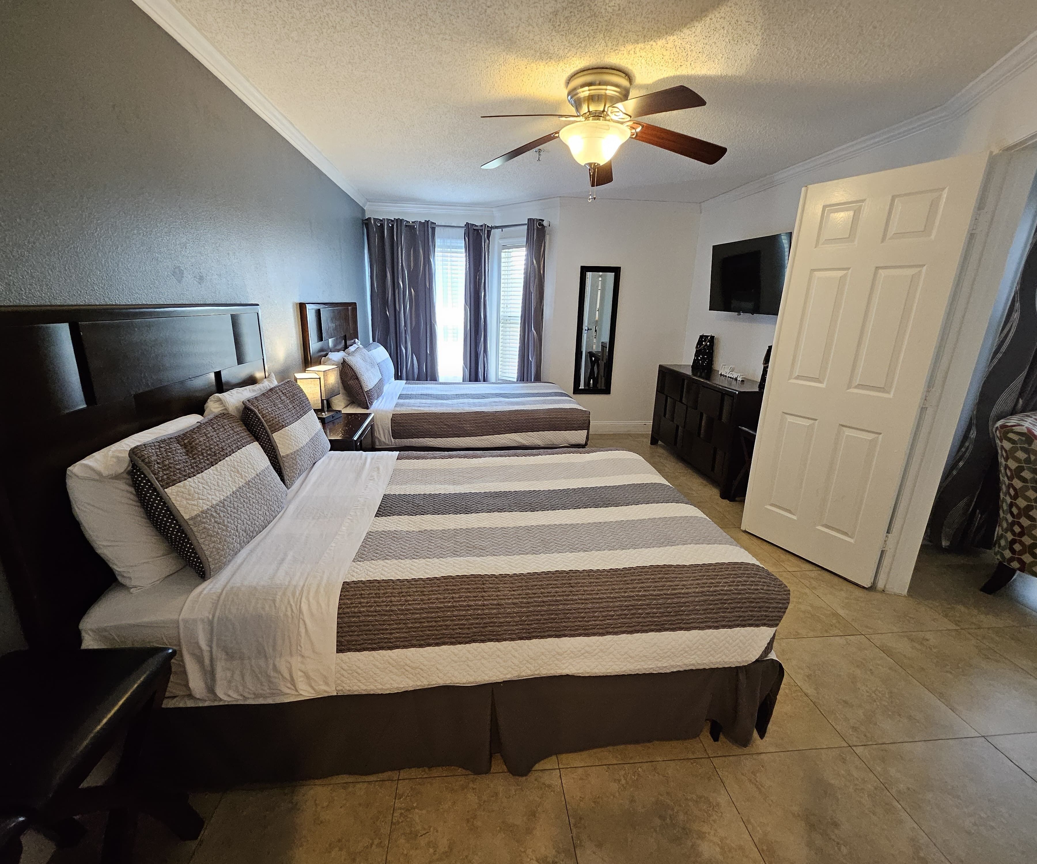 1 bedroom, desk, iron/ironing board, travel crib
