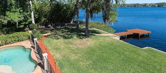 Lakeside Retreat~ Large home with pool, dock, game room and balcony on lakefront