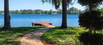 Lakeside Retreat~ Large home with pool, dock, game room and balcony on lakefront