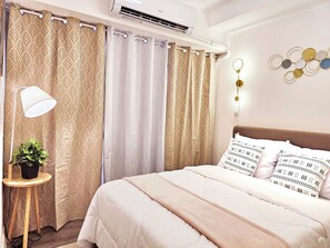 Deluxe Condo, Balcony, Mountain View | Premium bedding, down comforters, memory foam beds, in-room safe - Acellyne's Suites at The Residences (Quezon City)