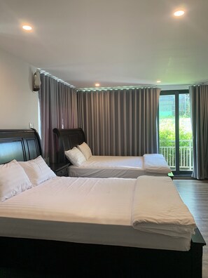 Exclusive Quadruple Room, Multiple Beds | Blackout drapes, soundproofing, iron/ironing board, free WiFi - Cowboy Hotel Quy Nhon (Quy Nhon)
