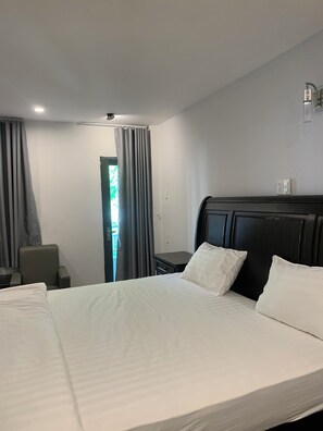 Grand Triple Room, 1 King Bed | Blackout drapes, soundproofing, iron/ironing board, free WiFi - Cowboy Hotel Quy Nhon (Quy Nhon)