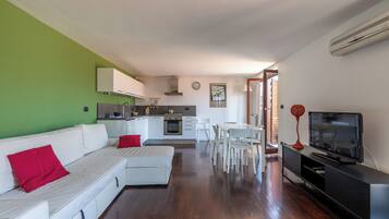 Apartment, City View | Living area | 35-inch TV with digital channels