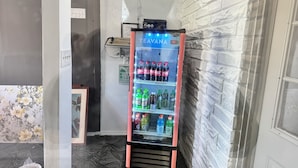 A vending machine with a variety of beverages, including Coca-Cola, Mountain Dew, and Zero.