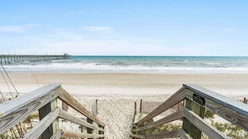On the beach, sun loungers, beach towels