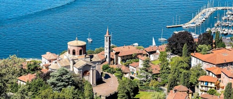 A coastal town with a prominent church, marina, and residential buildings.