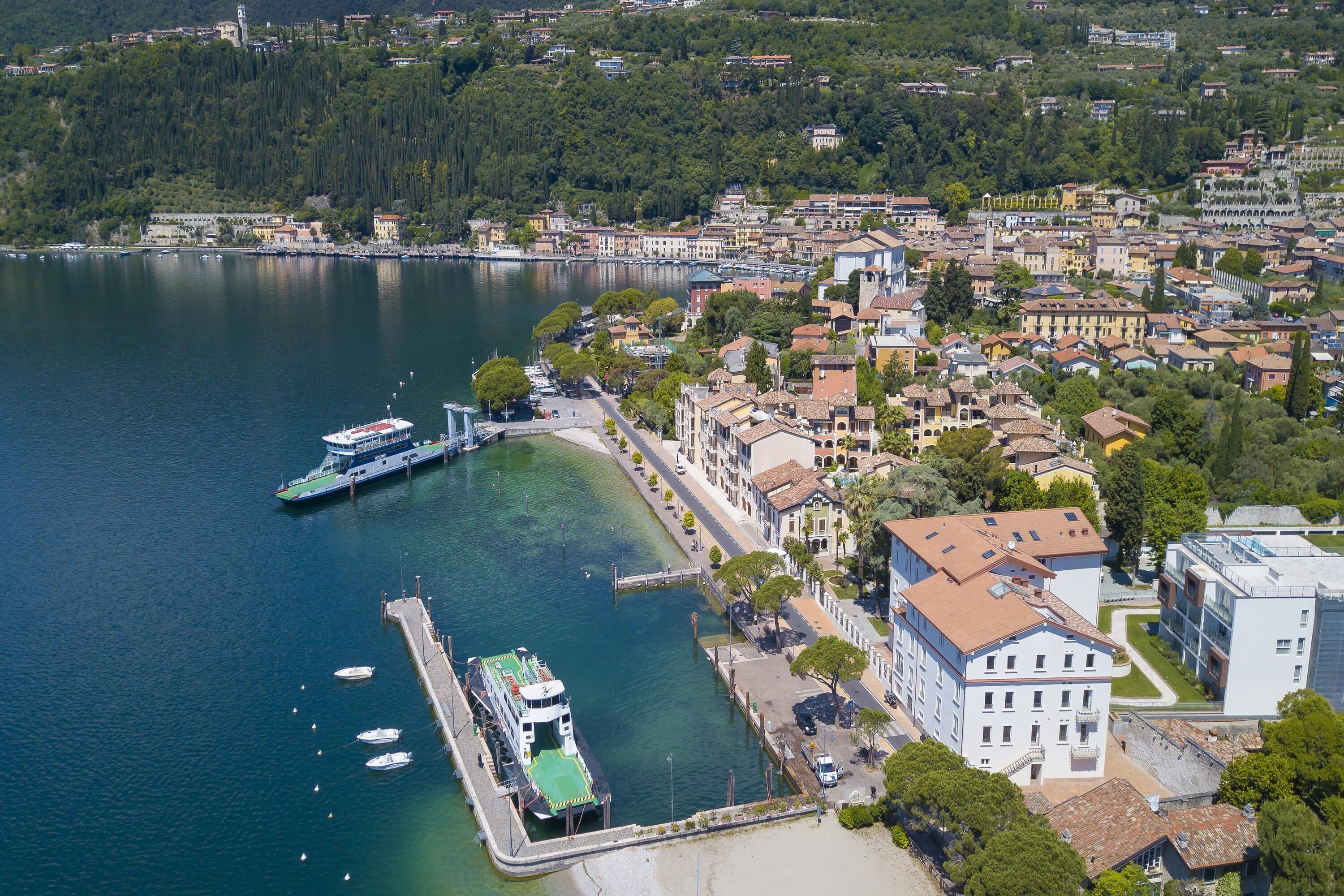 A coastal town with a marina, historic buildings, and a mix of residential and commercial structures.
