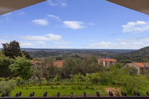 A view from a balcony overlooking a rural landscape with houses, trees, and a clear sky. - Villino di Corsanico With View (Massarosa)