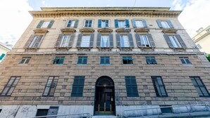 A historic building with a symmetrical facade, large windows, and a central entrance. - Nobel Flat - Historic Center (Genoa)