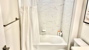 Shower, hair dryer, towels, soap
