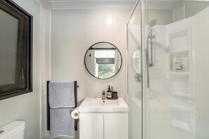 Shower, towels, soap, toilet paper