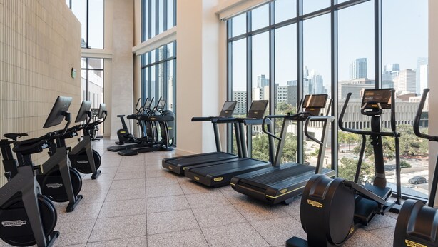 A gym with treadmills, stationary bikes, and elliptical machines. - Kasa at The Waller Austin (Austin)