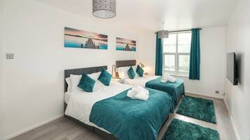 1 bedroom, desk, iron/ironing board, travel crib