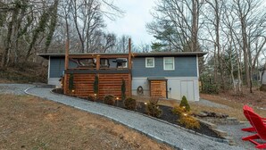 A modern two-story house with a wooden deck and a gravel driveway. - Beary Cozy | Pets, Work Station & 20 Min. from AVL (Black Mountain)
