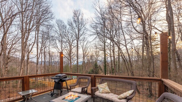 A deck with a fire pit, wicker furniture, and a grill. - Beary Cozy | Pets, Work Station & 20 Min. from AVL (Black Mountain)