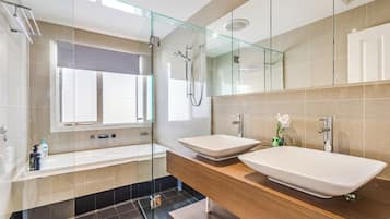 Separate bathtub and shower, hair dryer, towels