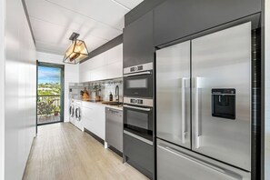 Fridge, microwave, oven, stovetop - Ocean Views, modern apartment 'Seabreeze on Alex' (Alexandra Headland)