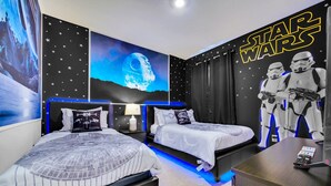 A Star Wars-themed bedroom with two beds, Star Wars posters, and themed wall decorations. - Luxurious 6BR villa in Davenport with Private Heated Pool, Game Room (Davenport)