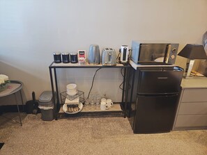 Enjoy a convenient kitchenette with a refrigerator, coffee maker, toaster, and kettle.