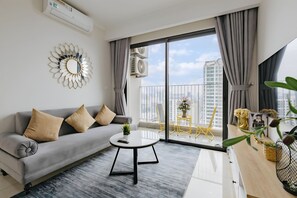 Business Apartment, 2 Bedrooms, Balcony, City View | Living area | 60-inch Smart TV with cable channels, books, pay movies