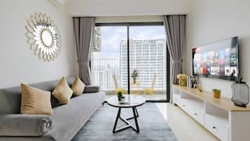 Business Apartment, 2 Bedrooms, Balcony, City View | Living area | 60-inch Smart TV with cable channels, books, pay movies