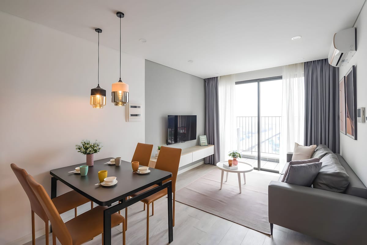 Senior Apartment, 1 King Bed, Balcony, City View | Living area | 60-inch Smart TV with cable channels, books, pay films