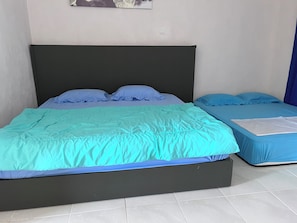 Suíte família | Espaço de trabalho para notebook, Wi-Fi de cortesia, roupa de cama