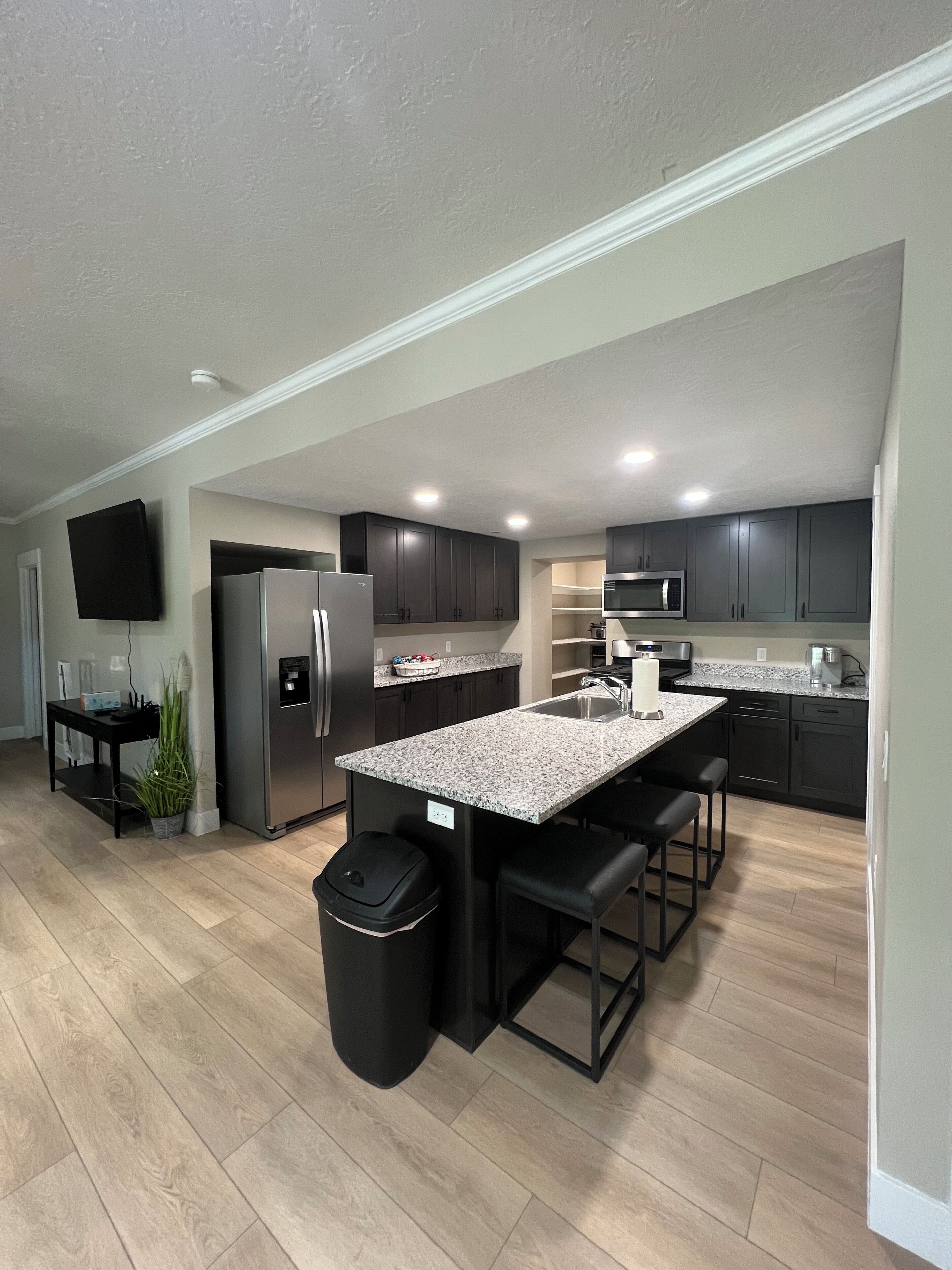 Kitchen with all cooking items. 8 sets of plates, cups etc.