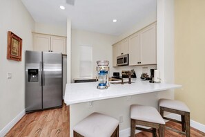 Fridge, oven, stovetop, dishwasher - Orange Creamsickle Cottage near Disney with Margaritaville Resort & Island H20. (Kissimmee)
