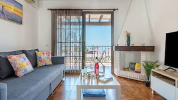 Standard Apartment, Multiple Bedrooms, Mountainside (Sunny Tranquility With Pool) | Living area | 32-inch Smart TV with cable channels