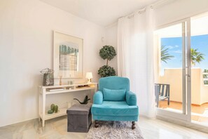 Family Apartment, Multiple Bedrooms, Mountainside (Calahonda Elegance With Pool And Sea) | Living area | 21-inch flat-screen TV with cable channels