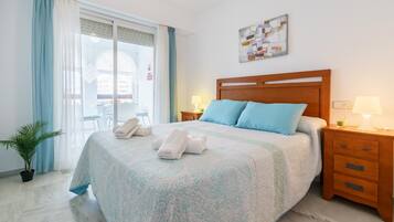 Family Apartment, 2 Bedrooms, 2 Bathrooms (Apartment Hispanidad With Pool) | 2 bedrooms, iron/ironing board, free WiFi, bed sheets