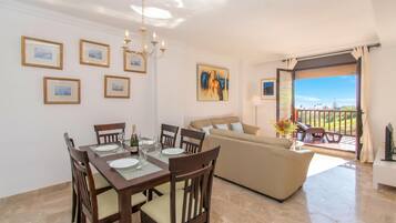 Honeymoon Apartment, Multiple Bedrooms, 2 Bathrooms (Costa Galera Apartment) | Living area | 21-inch Smart TV with cable channels