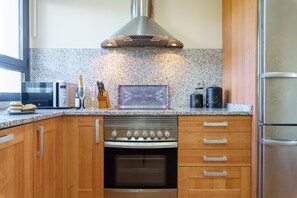 Family Apartment, Multiple Bedrooms, 2 Bathrooms, Mountainside (Sunset Seaview Corner With Pool) | Private kitchen | Fridge, microwave, oven, stovetop