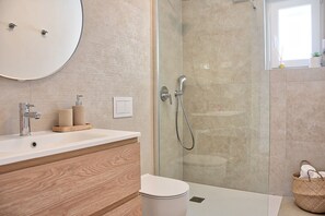 Shower, hair dryer, towels, soap