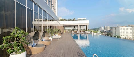 Outdoor pool, open 6:00 AM to 10:00 PM, sun loungers