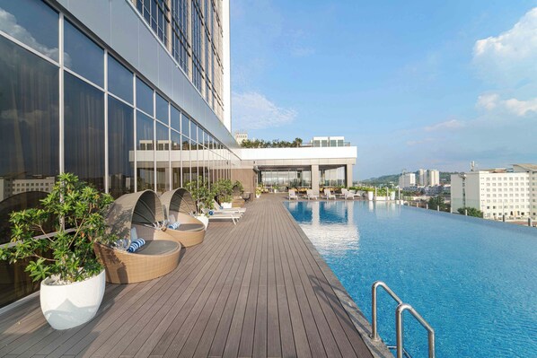 Outdoor pool, open 6:00 AM to 10:00 PM, sun loungers