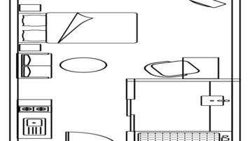Plano de un cuarto de hotel con cama, escritorio, silla, una mesita y ventana.