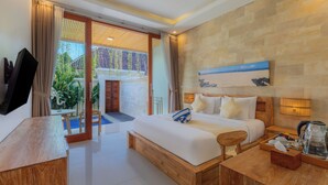 A hotel room with a bed, bedside table, and a view of the outside. - Bali Made Escape (Bangli)