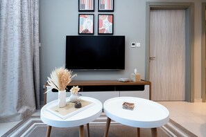 Deluxe Apartment, 1 Bedroom, Lake View | Living area | 50-inch Smart TV with digital channels - Contemporary -1BR Zada Towers (Dubai)