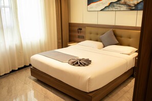 Premium bedding, down comforters, pillowtop beds, minibar