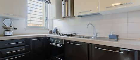 Apartment | Private kitchen | Fridge, oven, stovetop, dishwasher