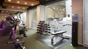 A gym with treadmills, ellipticals, dumbbells, and a water dispenser. - For Students Only Chapter South Bank in London (London)