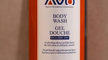 A bottle of AVO body wash gel with a decorative label.