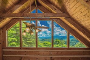Enjoy expansive views of the surrounding landscape from the room's large skylight.