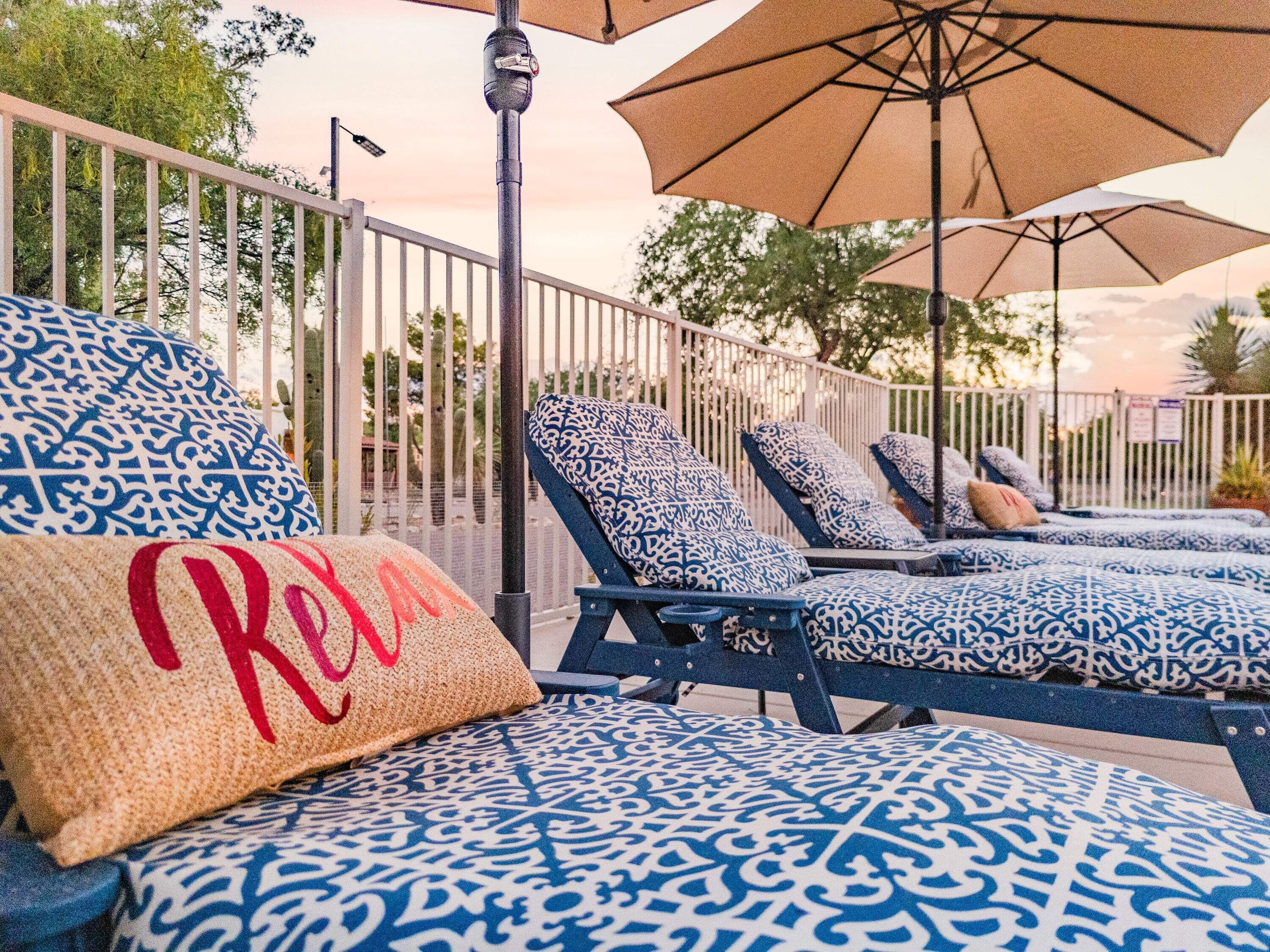 Sun Lounge Chairs and Umbrellas at Pool