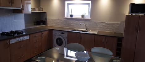 Fridge, microwave, stovetop, coffee/tea maker