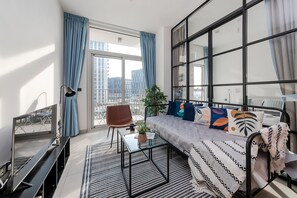 Apartment, Balcony, City View | Living area - Cozy 1BR in Socio Tower 2 (Dubai)