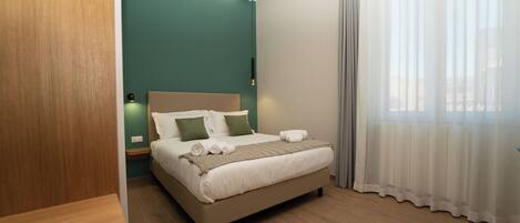 Frette Italian sheets, premium bedding, down duvets, minibar